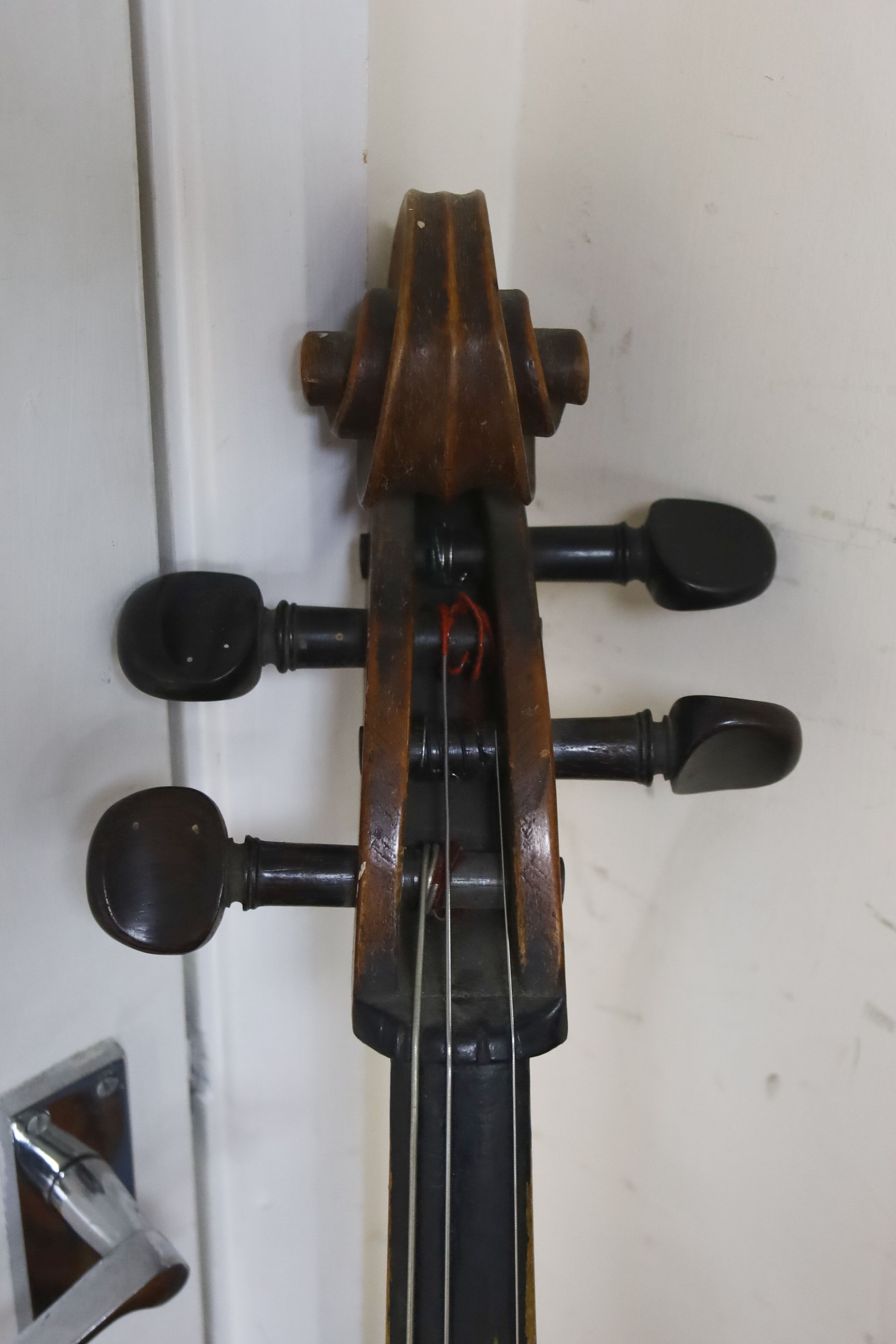 Early 20th century German cello and bow, the back measuring 75cm excluding the button